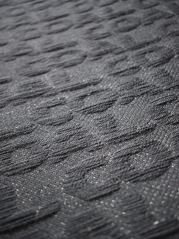 Jacquard fabric showing the text coal