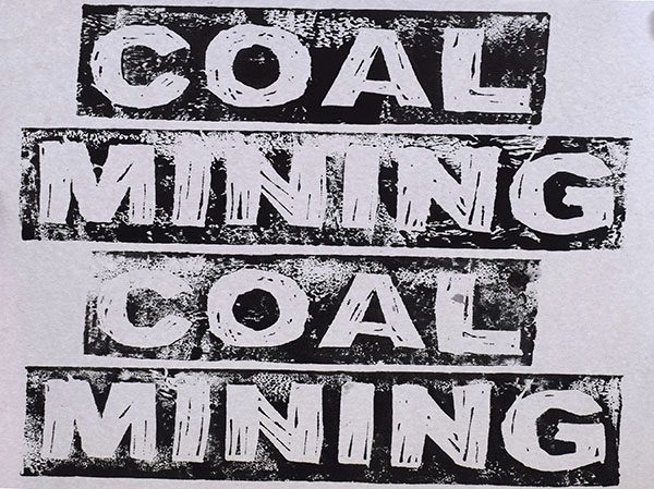 Coal mining text lino print