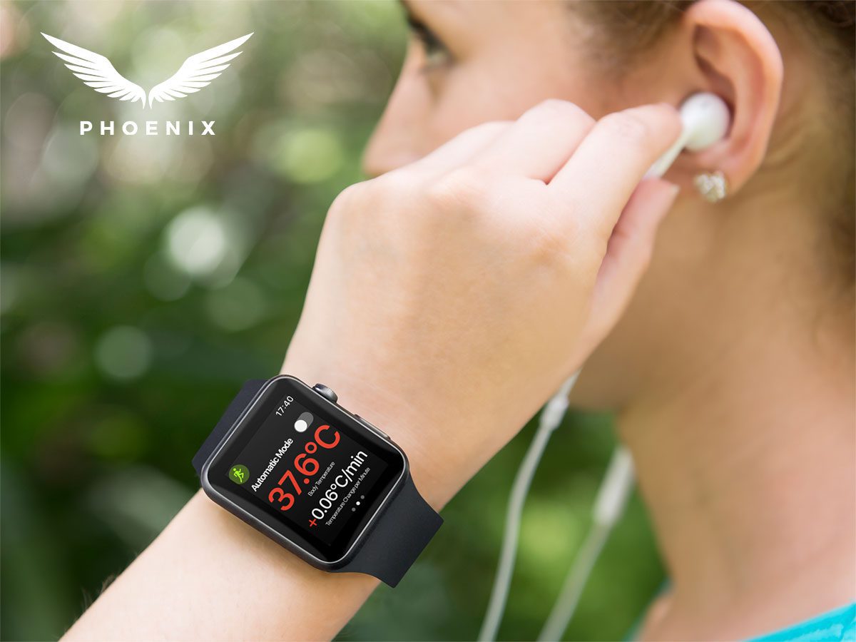 Image contains the phoenix logo in white in the top left corner of the image. Within the rest of the image is a side profile of a white woman putting her earphones into her ears whilst wearing a apple watch. On the apple watch is a screen from the Phoenix Sports Vest app that details the users temperature, whether automatic cooling mode is switched on or off, and a number for temperature change per minute.